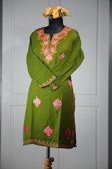 Kashmiri pheran displayed on a mannequin in Kashmir