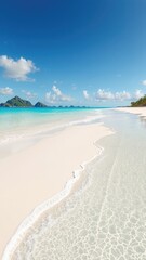 Turquoise Ocean Waters Gently Kiss a Pristine Sandy Beach Under a Bright Blue Sky with Soft, Fluffy Clouds