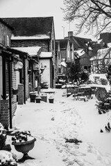 Snowy scenes from England Alcester, Warwickshire, UK tudor buildings and old houses and streets in snow, black and white greyscale 6