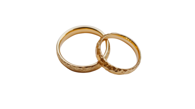 Two golden wedding rings in classic romantic design symbolizing love and marriage with shiny metallic finish isolated on white background