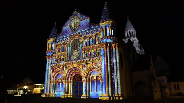 Exterior of Notre Dame la Grande church at night, in Poitiers. France