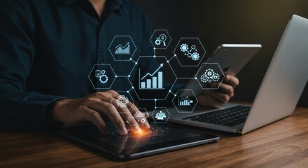 Businessman using tablet and laptop, digital interface with growth charts and icons