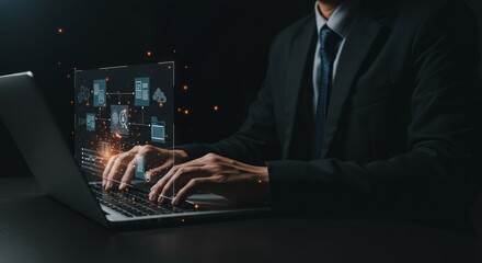 Businessman working on laptop with holographic interface