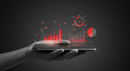 Hand holding a smartphone with digital graphs and charts overlayed
