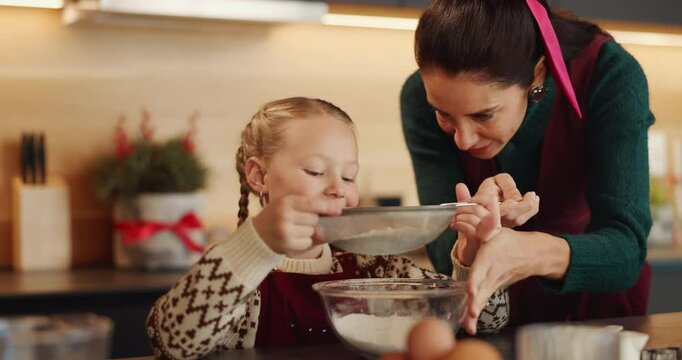 Flour, sift and mother with child for baking in kitchen for cooking, teaching or bonding in home. Ingredients, learning and mom with girl kid for preparing dessert, cookies or cake for snack in house