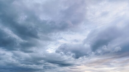 The dramatic clouds creating a serene and moody atmosphere in the sky.
