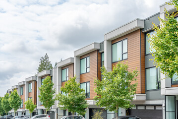 Top of modern apartment building with balcony, trees and beautiful landscape in Vancouver, Canada, North America. Day time on June 2025.