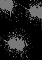 Gray paint splashes on black background in abstract style  