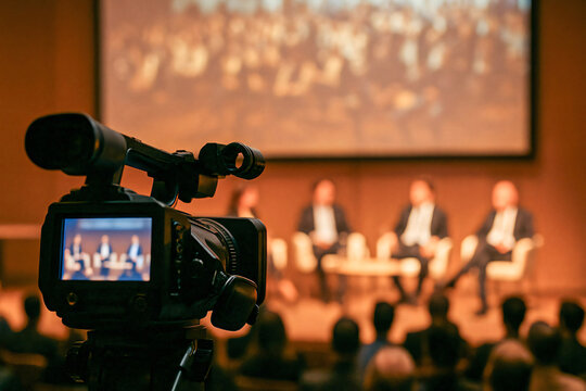 Behind-the-Scenes of a Seminar with Camera Focused on Panel Discussion - Powered by Adobe