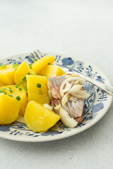 Delicious hearty fish dinners, boiled potatoes with pickled herring