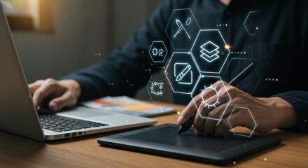 Person using graphic design tools on laptop and digital tablet