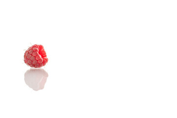 Fresh sweet raspberries isolated on white background, macro.