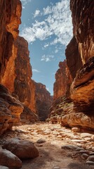 Canyon Adventure: Rocky Landscape under Blue Sky with Sandstone Cliffs