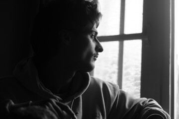 Moody black and white portrait of a young Kashmiri Gen Z boy, capturing raw emotion, identity, and...