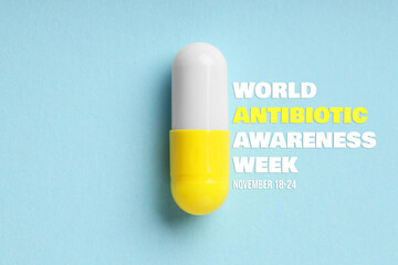 World antibiotic awareness week. One pill on light blue background, top view