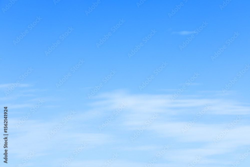 Wall mural fantastic soft white clouds against blue sky and copy space horizontal shape. web banner.website hea