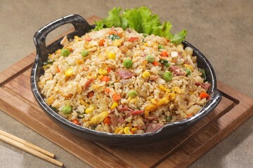 Nasi goreng Hongkong. Chinese Fried rice is a dish of cooked rice that has been stir-fried in a wok...