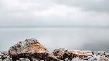 Fototapeta premium Serene coastal scene, smooth ocean rock on the sandy beach smooth