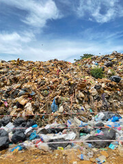 Pile of domestic garbage in landfill background. Stock photo.
