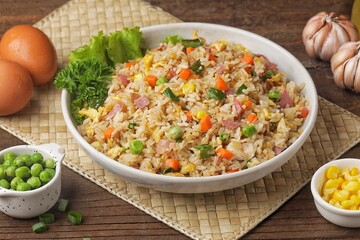 Nasi goreng Hongkong. Chinese Fried rice is a dish of cooked rice that has been stir-fried in a wok or a frying pan and is with other ingredients such as eggs, vegetables, seafood, or meat