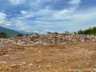 Pile of domestic garbage in landfill background. Stock photo.