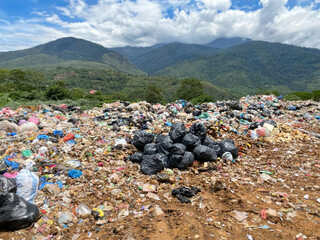 Pile of domestic garbage in landfill background. Stock photo.