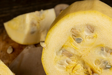 cut squash with a hard peel, ripe white squash on the kitchen during cooking and slicing, close up