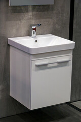 Modern ceramic bathroom sink width silver metal tap inside home interior