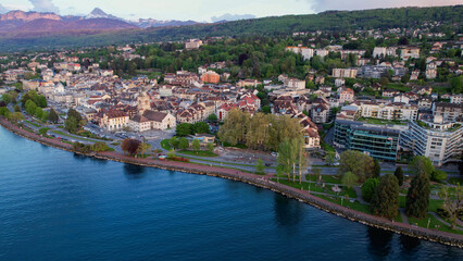 A panoramic aerial view around the old town of the city Evian-les-Bains in France on a sunny spring...
