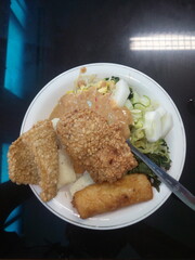 A traditional food called Gendar Pecel, with the main component of gendar, namely mashed rice and seasoned with garlic, coriander, and salt.