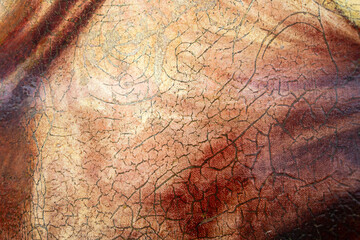 Close-up of cracked and weathered surface of antique painting