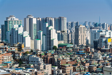 Seoul cityscapes, skyline, high rise office buildings and skyscrapers with blue sky and cloud in...