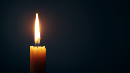 Burning candle flame glowing softly against dark background symbolizing warmth, light, and calm atmosphere in a minimalistic setting.