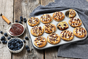 tasty blueberry muffins with lemon chocolate glaze