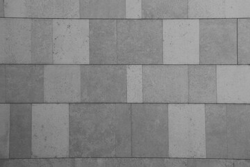 modern grey gray concrete marble tile wall floor background and beige flooring texture pattern. front view.