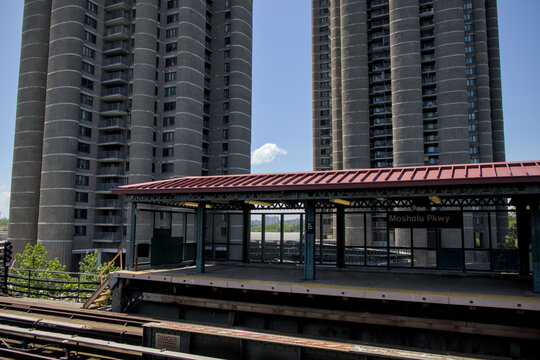tall residential housing apartment towers in the bronx new york (high rise residence project buildings) subway platform parkway - Powered by Adobe