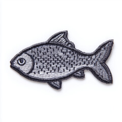 Fish-shaped embroidered iron-on patch isolated on white