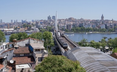 Elevated view of Istanbul metro bridge and cityscape with Galata Tower
