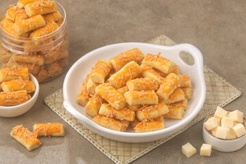 Kue Kastengel. Kaasstengels (Dutch, kaas, cheese; stengel, stem) are pastries made from a mixture of wheat flour, eggs, margarine and grated cheese.