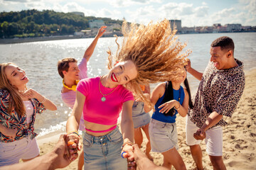 Group of friends enjoying a vibrant summer beach day with cheerful vibes and joyful moments by the water