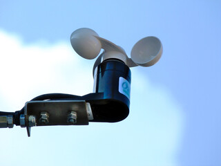 anemometer wind speed indicator measuring device fixed to aluminum bracket on tube post....