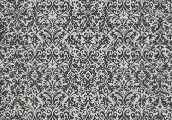 Detailed ornate pattern in black and white with floral and scroll elements