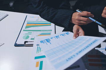 Two business people analyzing the data