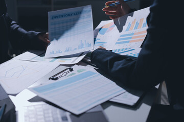 Group of business women working on a financial data expenses document.