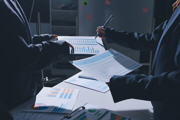 Group of business women working on a financial data expenses document.