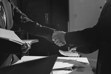 Happy two Asian business man and woman handshake to congratulate success. Successful Asian business people working together team.