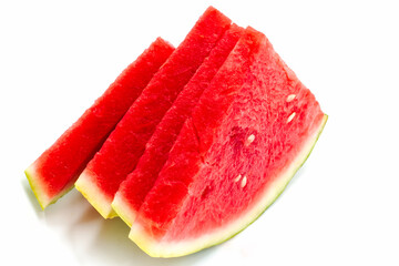 Fresh watermelon slices arranged nicely on a white surface ready for summer enjoyment and healthy...