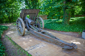 Antique Cannon in a Park. Old Artillery weapon gun mortar howitzer.