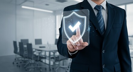 Businessman using digital interface with shield symbol indicating data protection and security