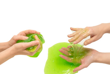 Green slime toy in woman hand isolated on white background.